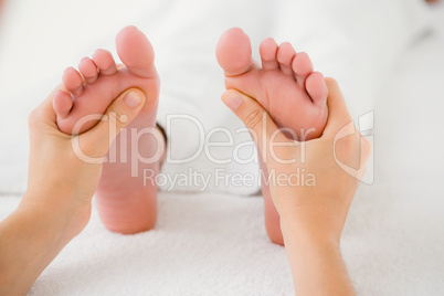 Close-up of a woman receiving foot massage