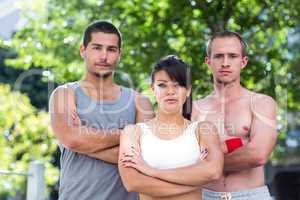 Portrait of extreme athletes looking at camera with arms crossed