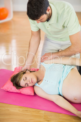 Pregnant woman having relaxing massage