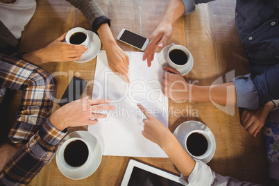 Friends discussing and drinking coffee