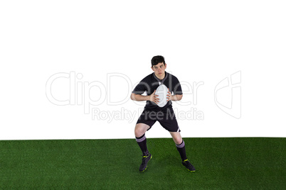 Rugby player running with the rugby ball