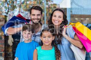Portrait of a happy family with shopping bags