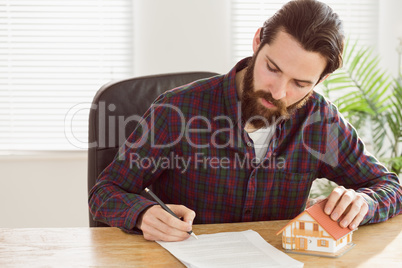 Hipster businessman applying for a mortgage