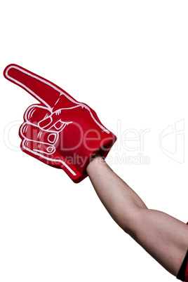 American football player holding supporter foam hand