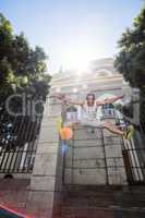 Extreme athlete jumping in the air in front of a building