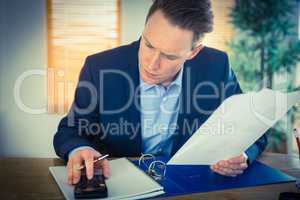 Concentrated businessman reading a document