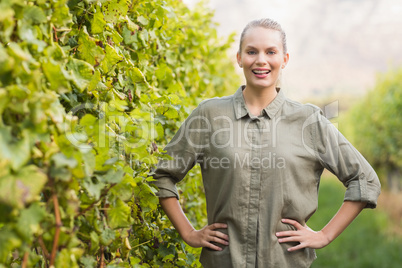 Young happy vintner smiling at camera