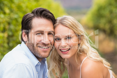 Young happy couple smiling at camera