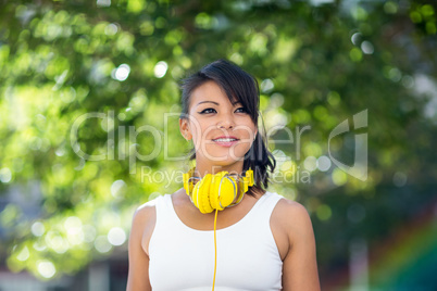 Athletic woman wearing yellow headphones