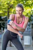 Portrait of a beautiful athlete using her phone