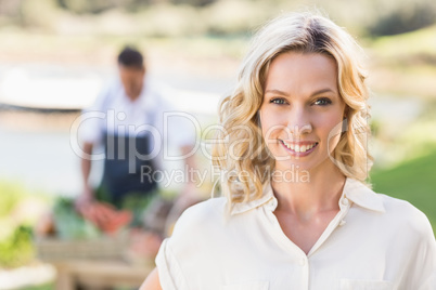 Smiling blonde woman looking at the camera