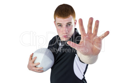 Rugby player gesturing stop sign