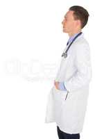 Serious doctor with hands in pocket
