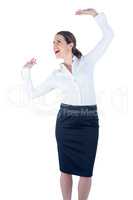 Pretty businesswoman dancing and cheering