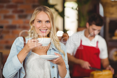 Pretty woman enjoying a cup of coffee