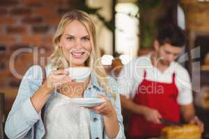 Pretty woman enjoying a cup of coffee