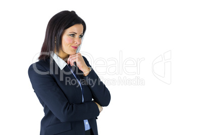 Brunette businesswoman thinking with hand on chin