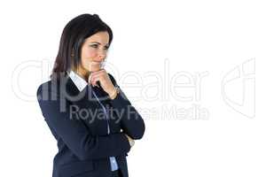 Brunette businesswoman thinking with hand on chin