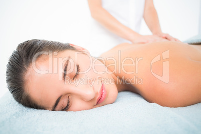 Beautiful brunette enjoying a massage