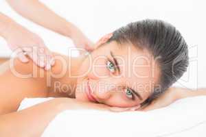 Attractive woman receiving back massage at spa center