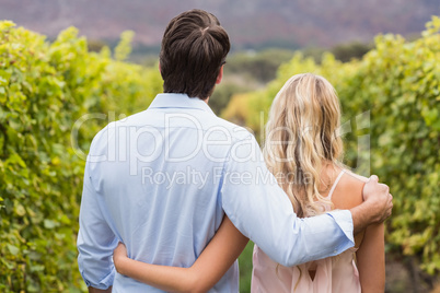 Young happy couple having an arm around each other