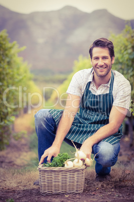 Young happy farmer looking at the camera