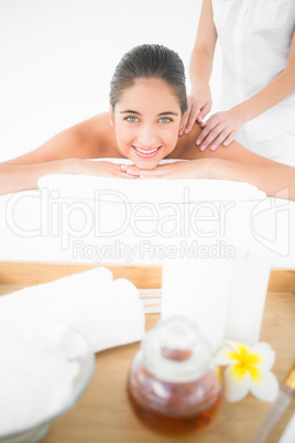 Attractive woman receiving back massage at spa center