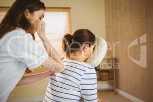 Young woman getting massage in chair