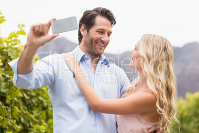 Young happy couple taking a selfie