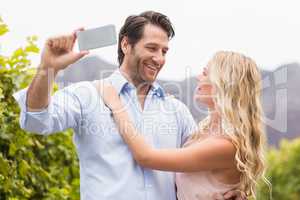 Young happy couple taking a selfie