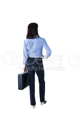 Businesswoman standing with her briefcase