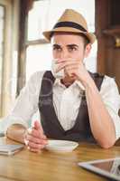 Hipster having cup of coffee