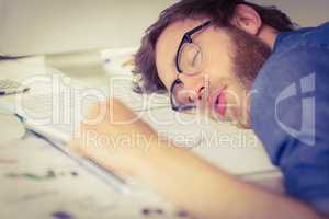 Hipster businessman sleeping at his desk