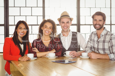 Smiling friends looking at the camera