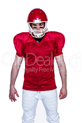 Serious american football player looking at camera