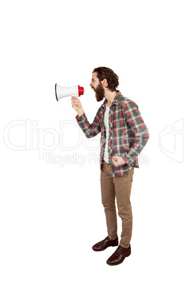 Handsome hipster shouting through megaphone