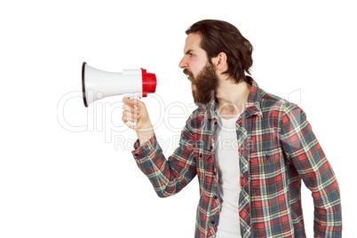 Handsome hipster shouting through megaphone