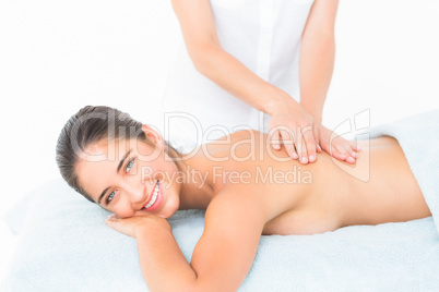 Beautiful brunette enjoying a massage