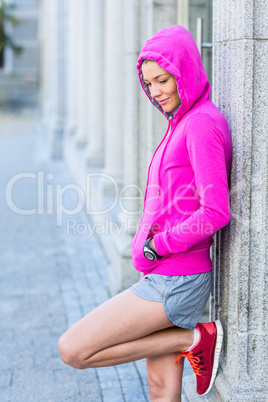 A woman wearing a pink jacket