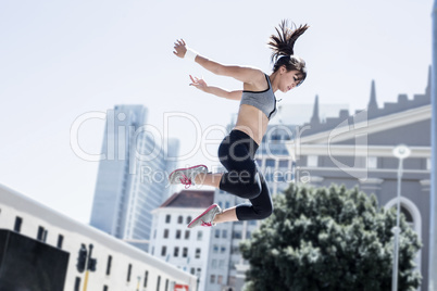 Woman doing parkour in the city