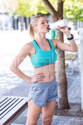 A beautiful woman sitting and drinking