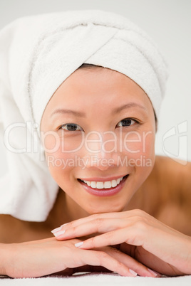 Smiling woman lying on the massage table