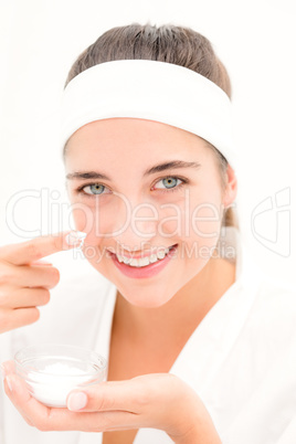 Beautiful smiling woman mid section of woman applying cream