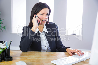 Businesswoman working at her desk