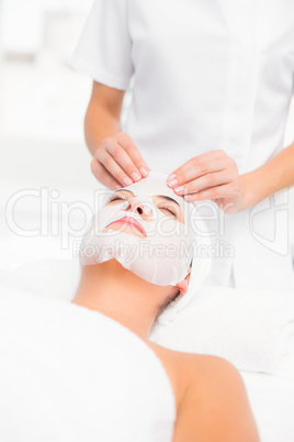 Beautiful brunette getting a facial treatment