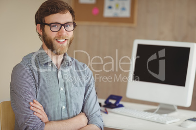 Hipster businessman smiling at camera