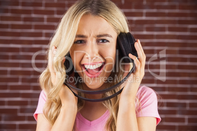 Portrait of a beautiful woman singing with headphones