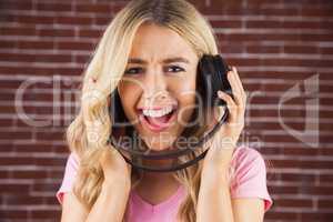 Portrait of a beautiful woman singing with headphones