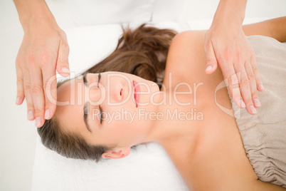 Beautiful young woman on massage table