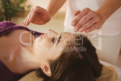 Young woman having a reiki treatment